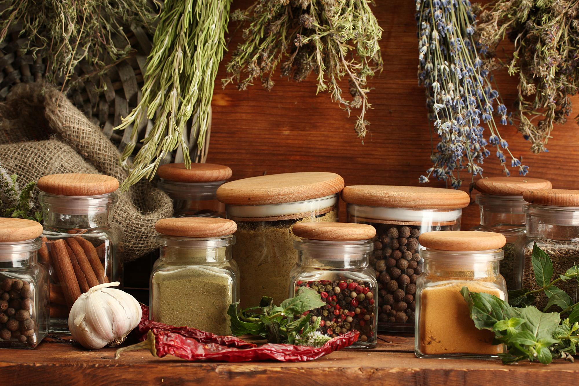 close-up of preserved herbs and jars